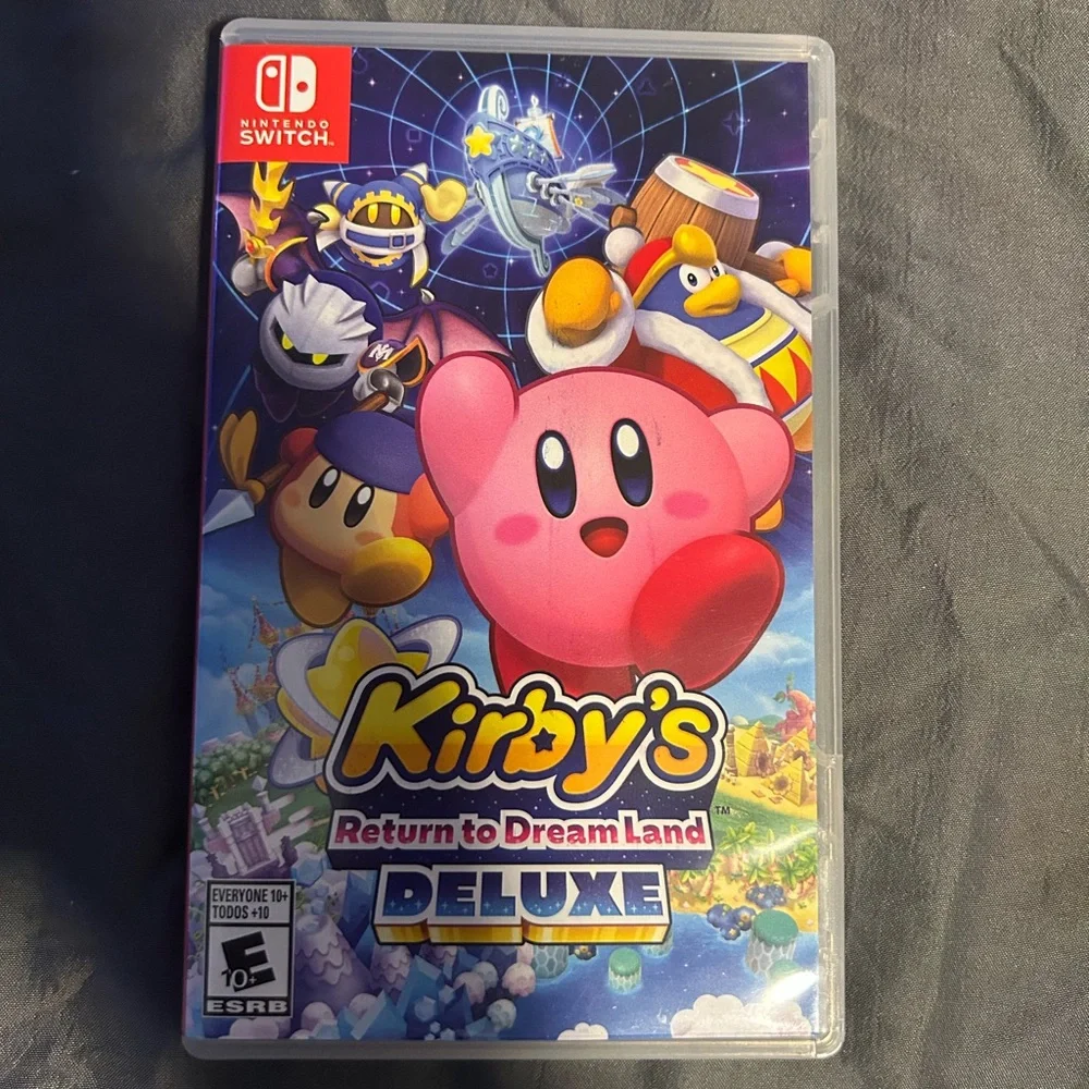 Nintendo Switch with gray Dock, Blue Kirby Case and Sonic Controller Accents,